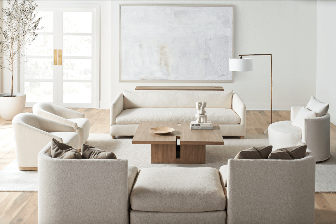 A cozy home living room seating arrangement in whites and creams